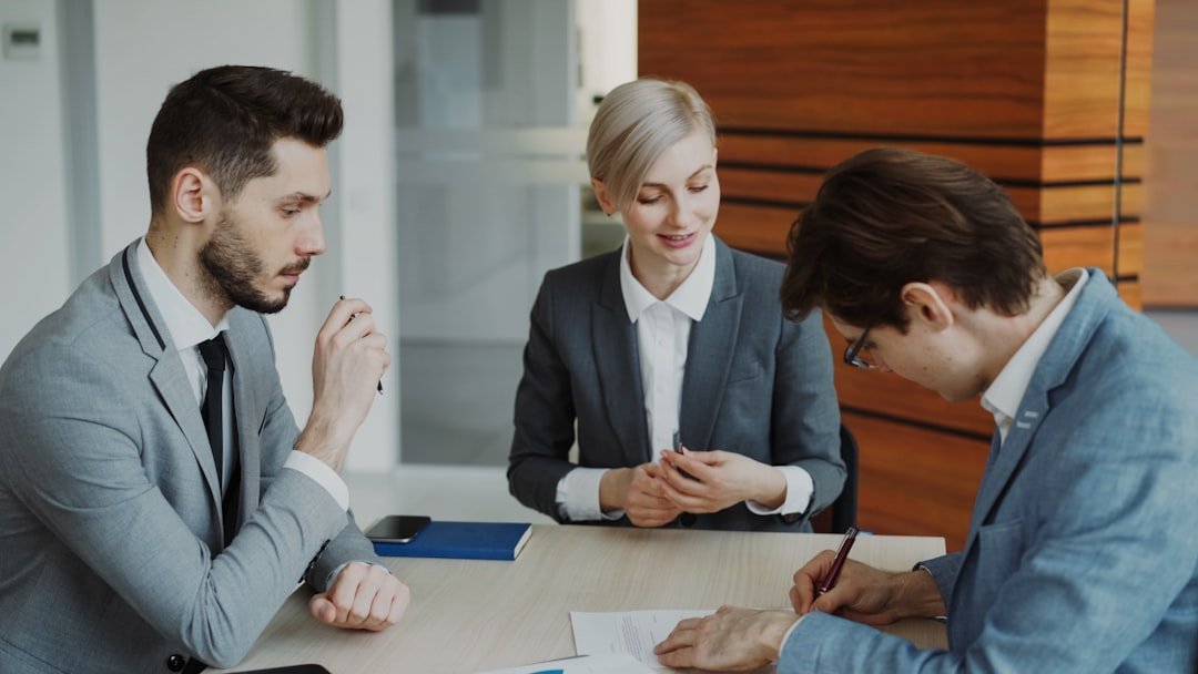 Professional document consultation at an office desk
